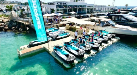 Sea-Doo jet skis and customers preparing for a guided jet ski tour at jetski.club platform in Marina Santa Eulalia Ibiza near CBbC beach club 