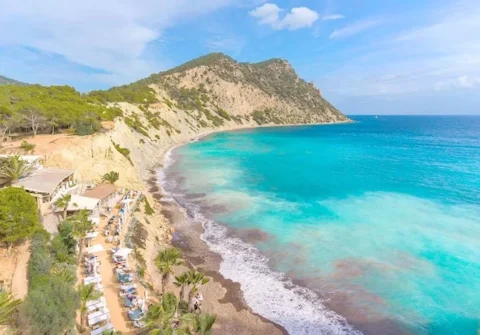 Ibiza east coast cove Cala Sol den Serra with clear water and natural coastline jet ski area