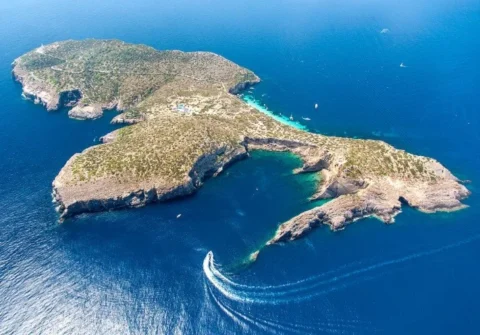 Tagomago island Ibiza coastline with crystal clear water jet ski tour route east coast