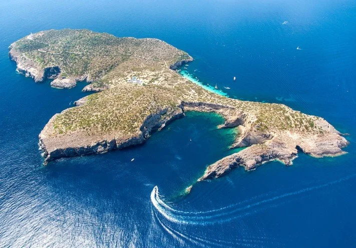 Tagomago island Ibiza coastline with crystal clear water jet ski tour route east coast